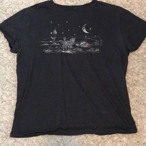 Black short sleeved shirt with a wolf howling at the moon on the front